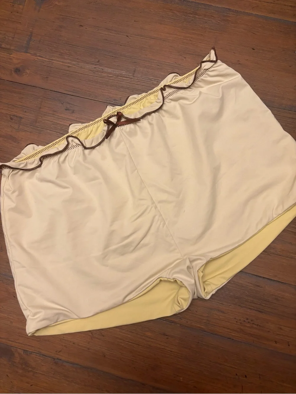 Frankie’s bikinis x Gigi HADID yellow swim shorts with brown trim